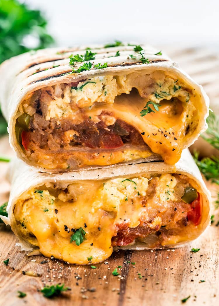 a stack of breakfast burritos