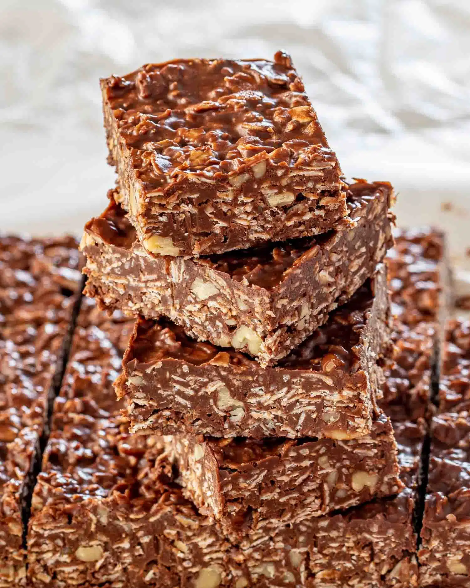 a stack of no bake peanut butter chocolate bars.