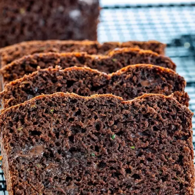slices of chocolate zucchini bread on a cooling rack