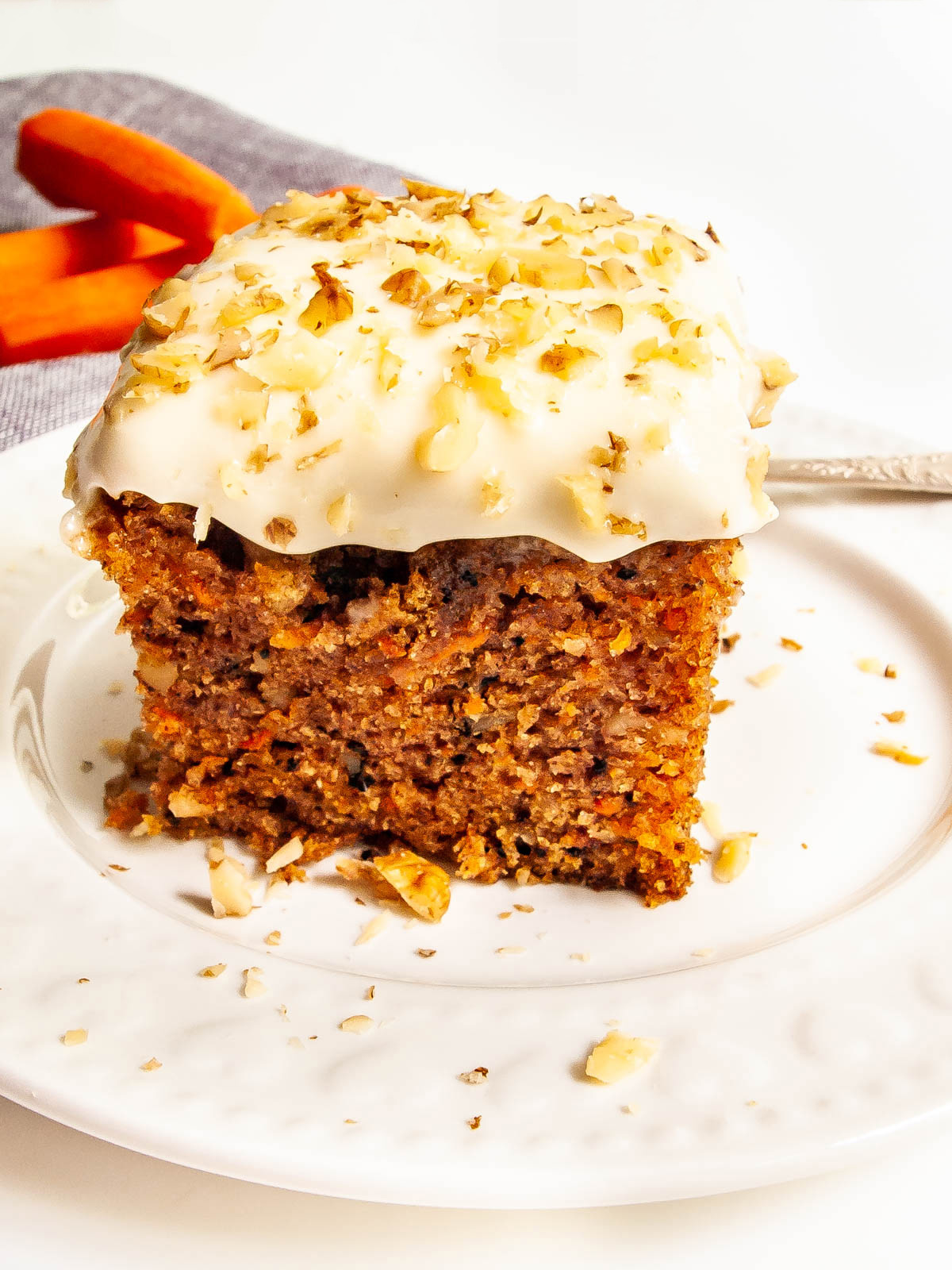 a slice of carrot cake on a plate