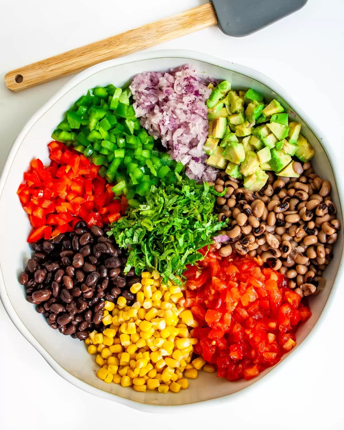 all ingredients in a bowl needed to make Cowboy Caviar
