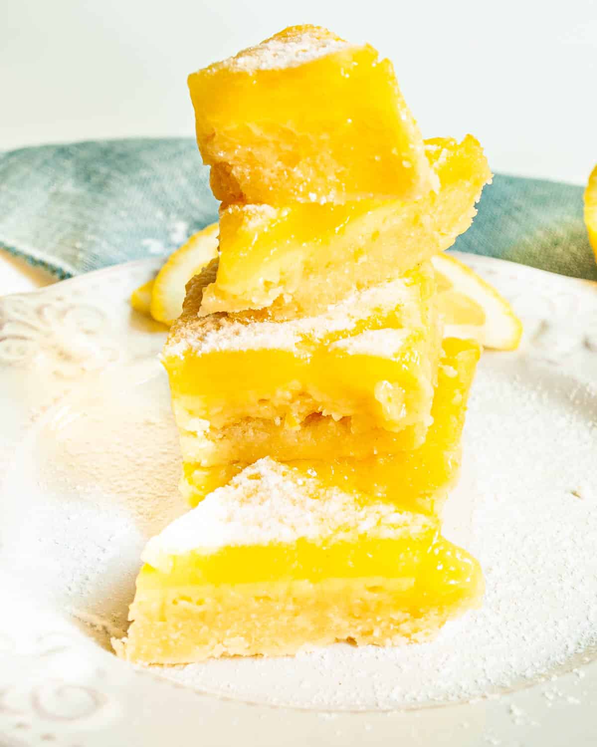 a stack of lemon bars cut into triangles