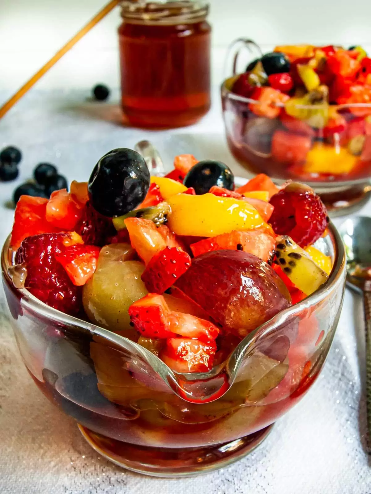two bowls filled with fruit salad