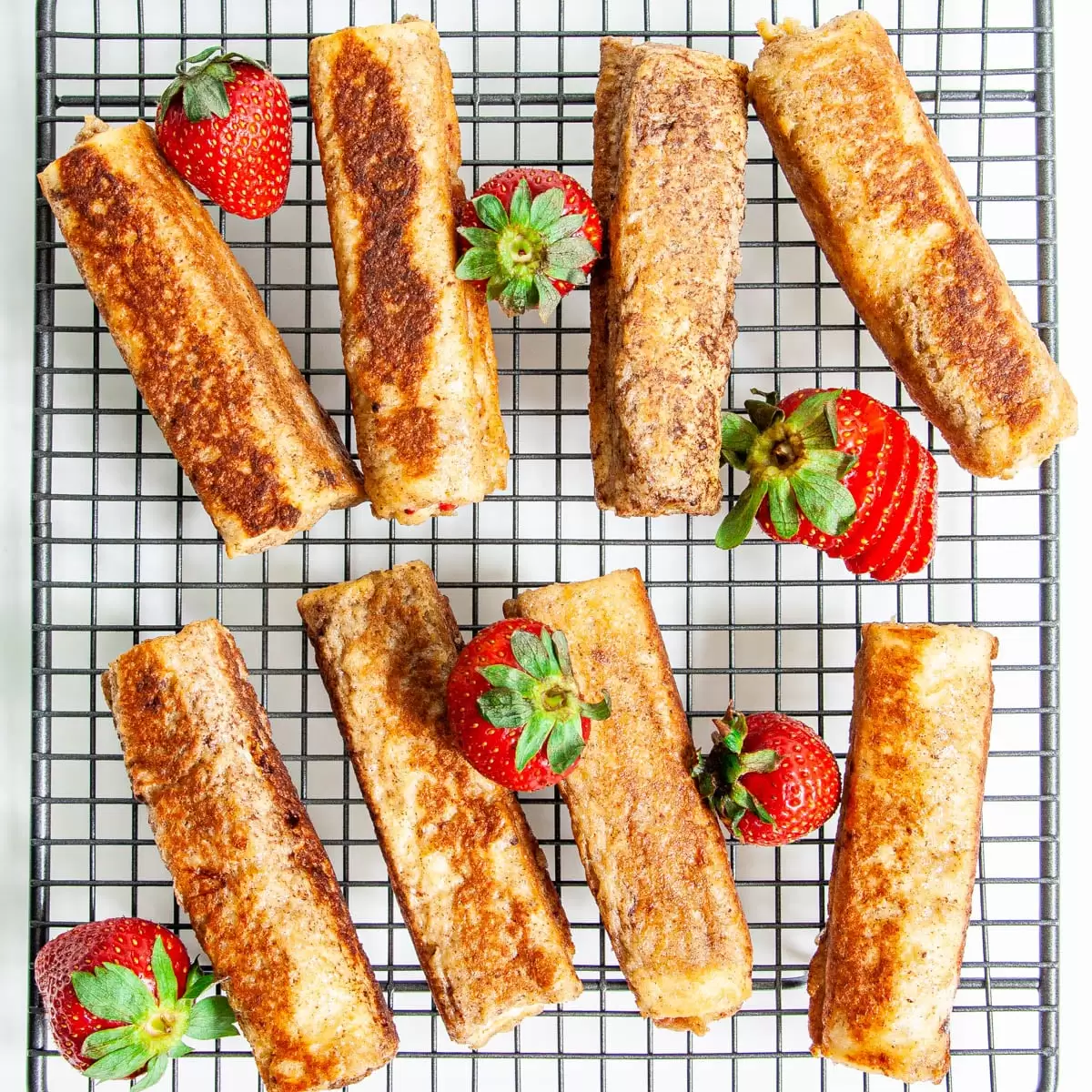 overhead shot of french toast roll ups on a cooling rack