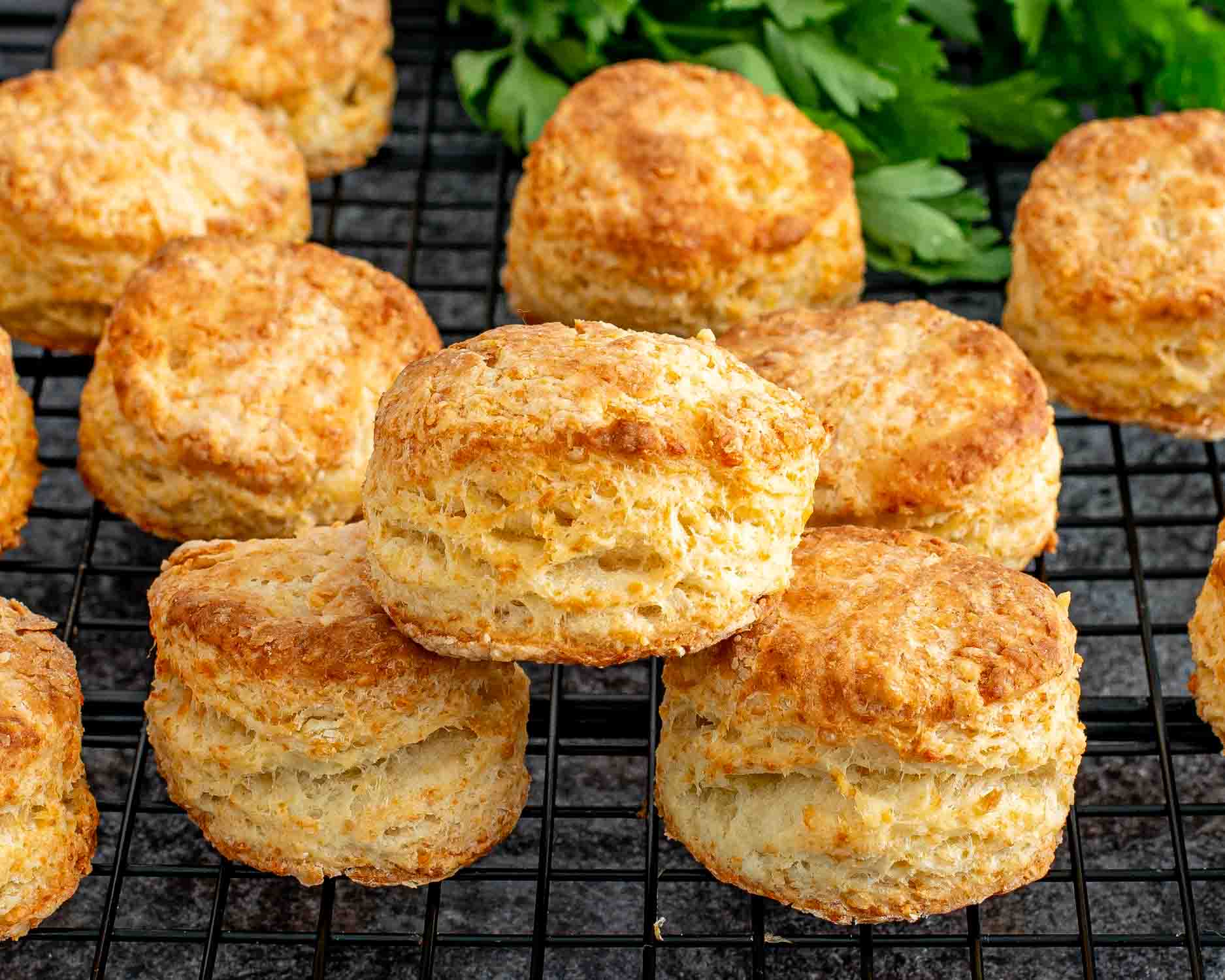 a stack of freshly baked buttermilk parmesan biscuits.