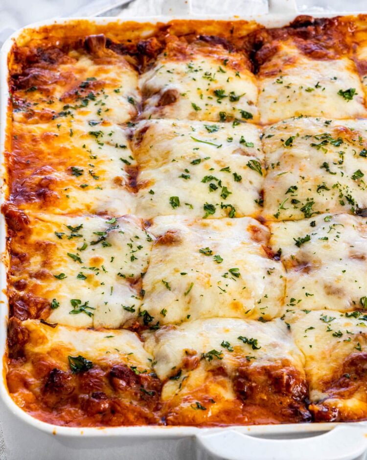 a lasagna pan right out of the oven cut into slices