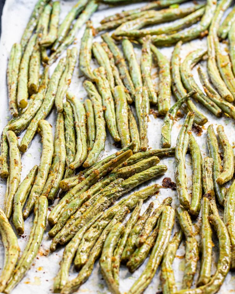 roasted green beans on a baking sheet fresh out of the oven