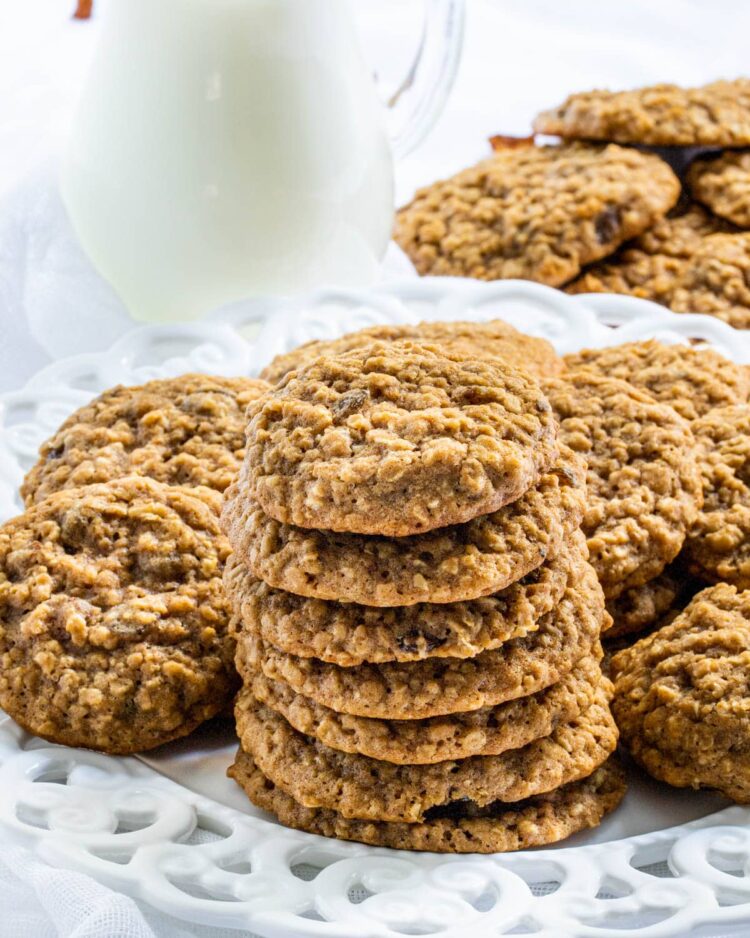 a stack of oatmeal cookies on a white plate