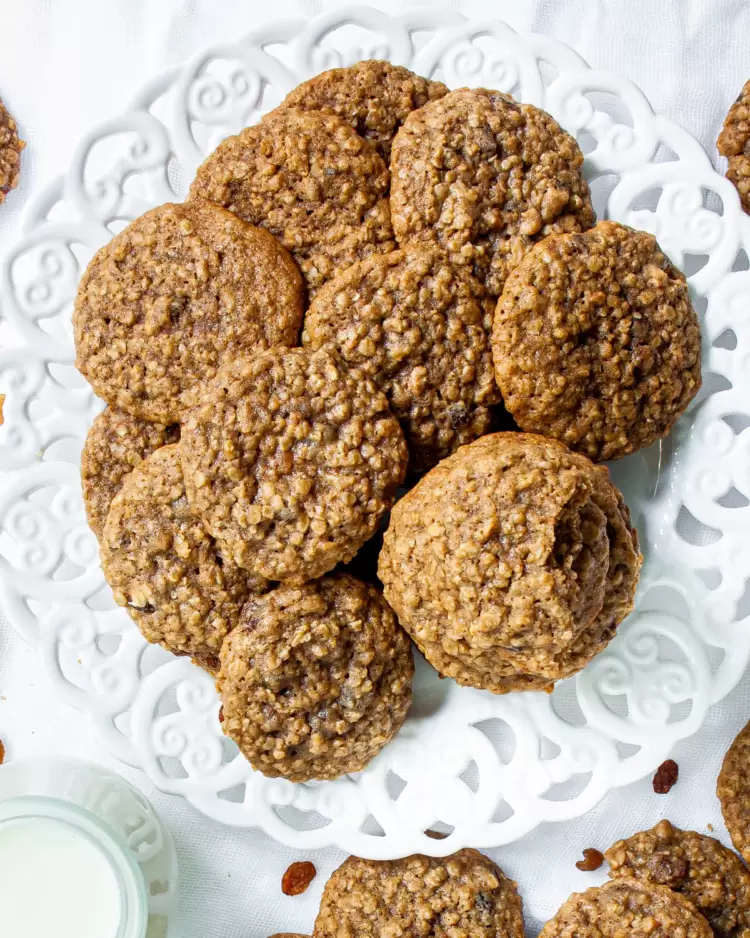 a bunch of oatmeal cookies on a white plate