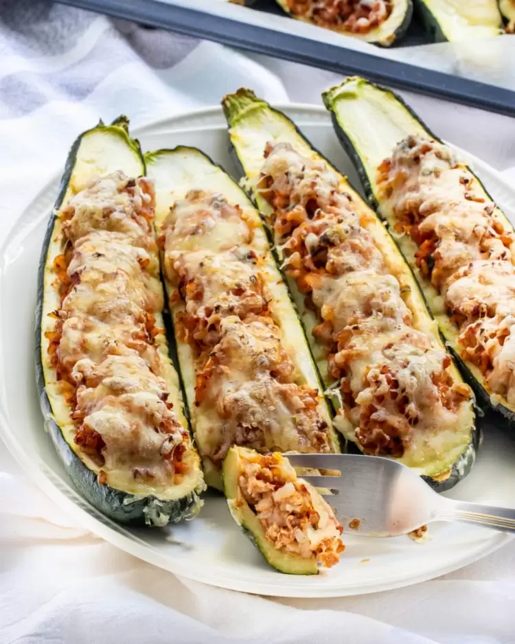 zucchini boats on a white plate