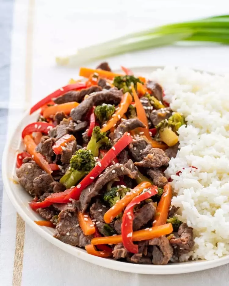 beef stir fry in platter with rice