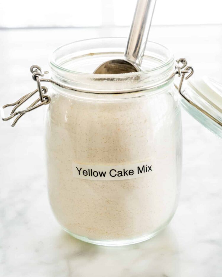 homemade cake mix in a jar with a scoop inside