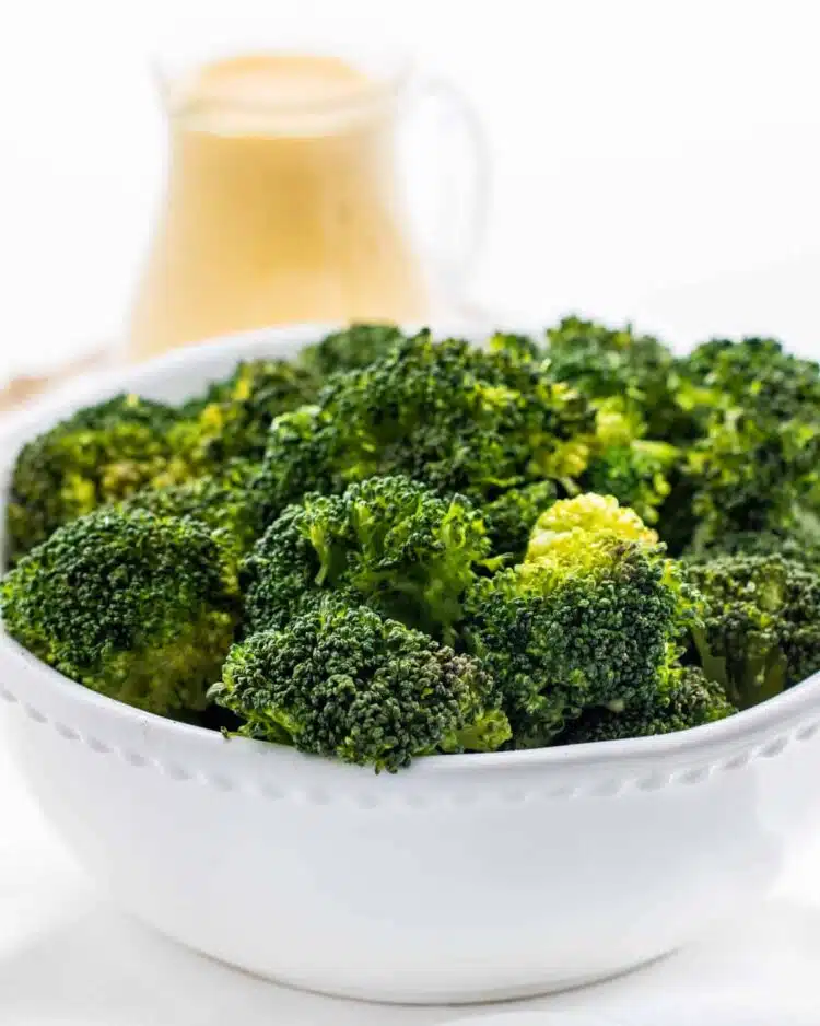 steamed broccoli in a white bowl