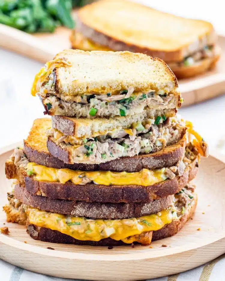 a gorgeous stack of tuna melts with the top one cut in half