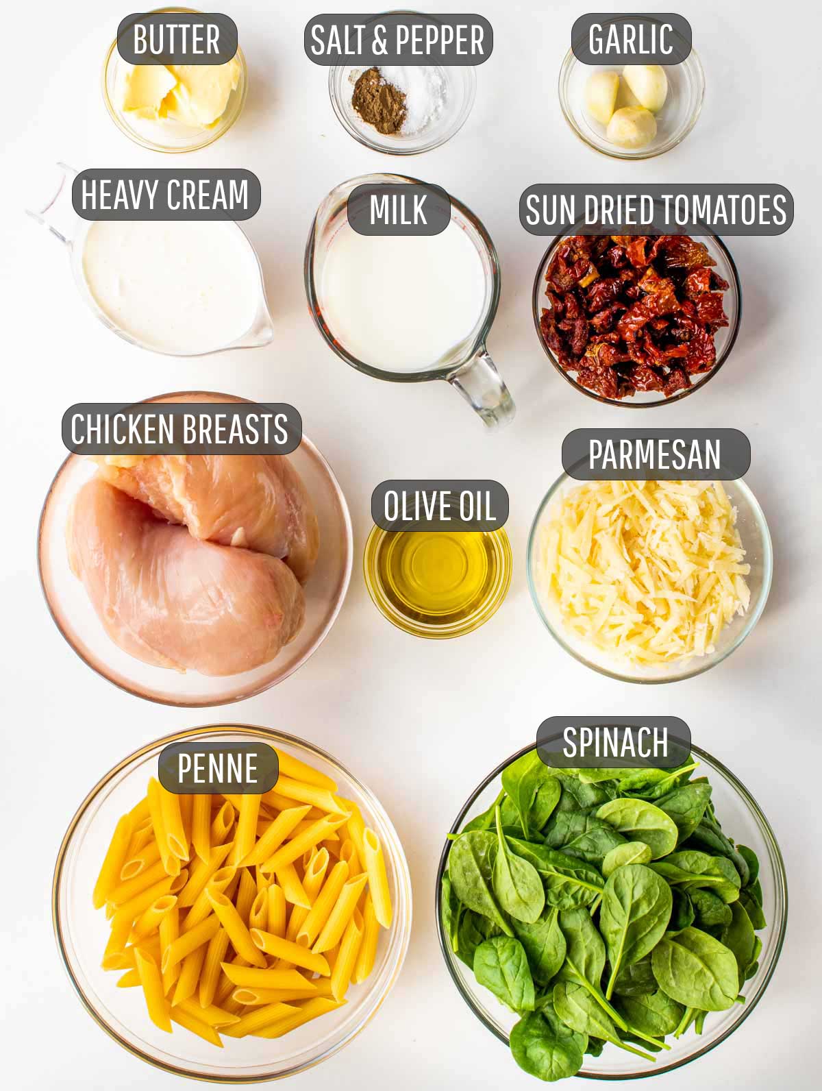 overhead shot of ingredients needed to make creamy tuscan chicken pasta.
