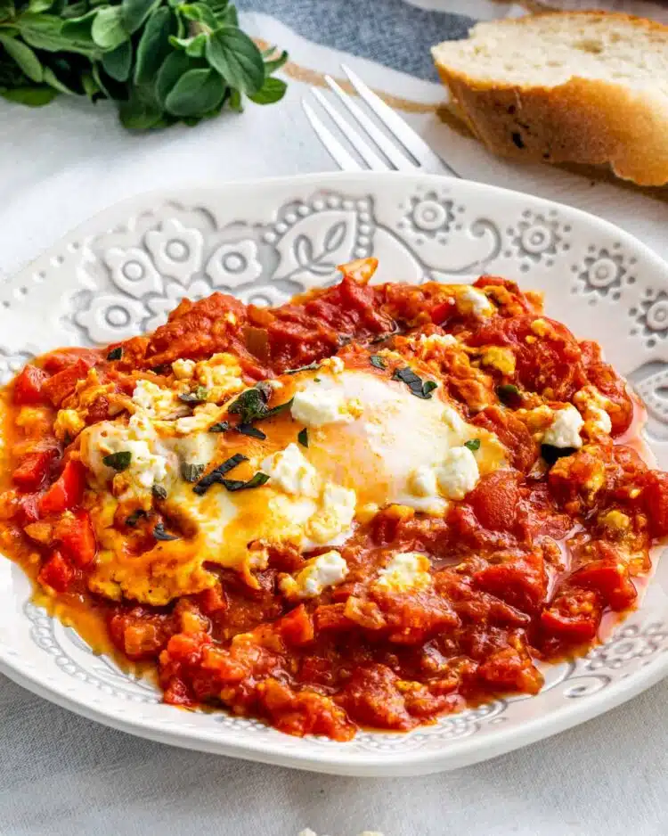 a white plate with shakshuka serving.