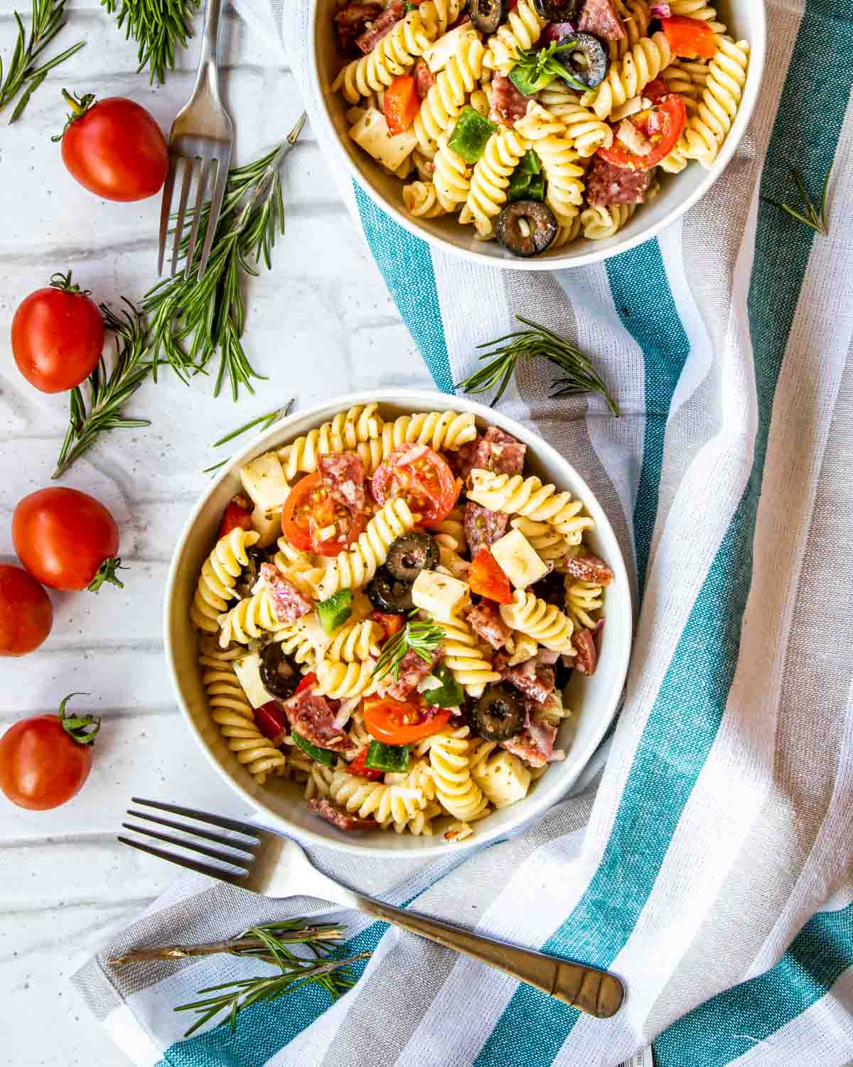 italian pasta salad in 2 white bowls.