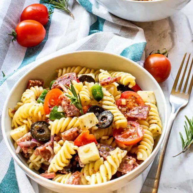 italian pasta salad in 2 white bowls.