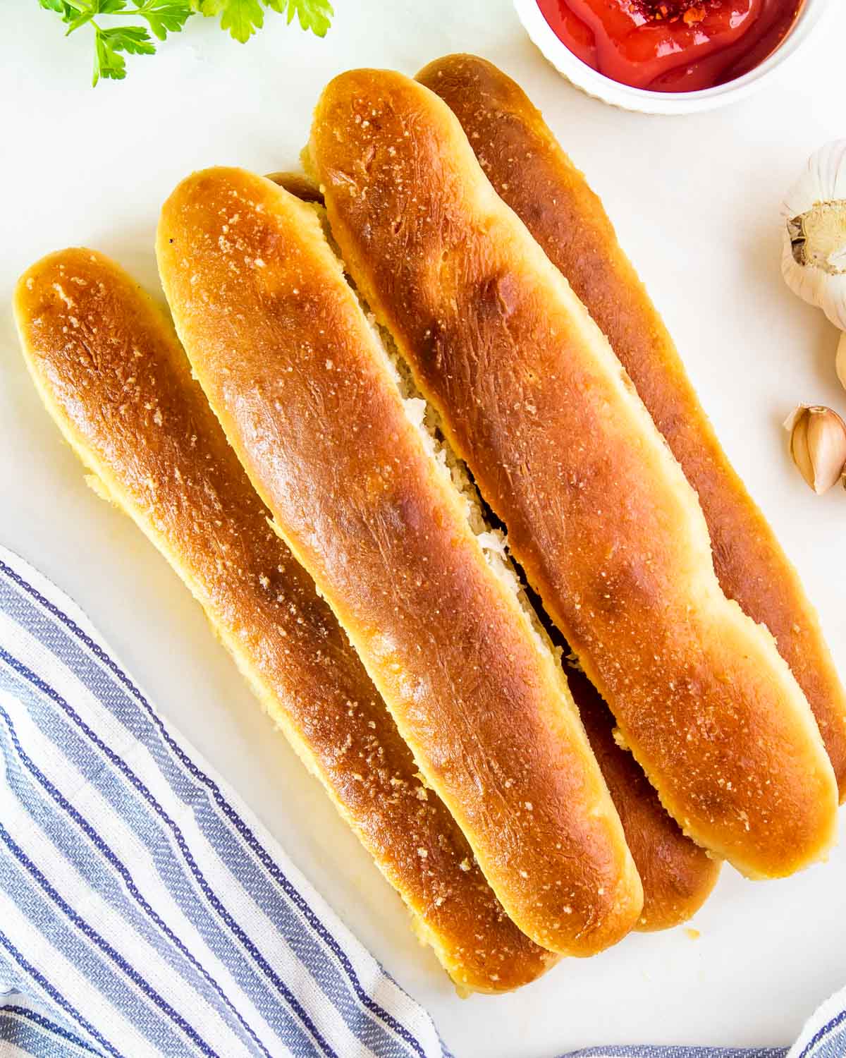 a bunch of breadsticks stacked on top of each other.