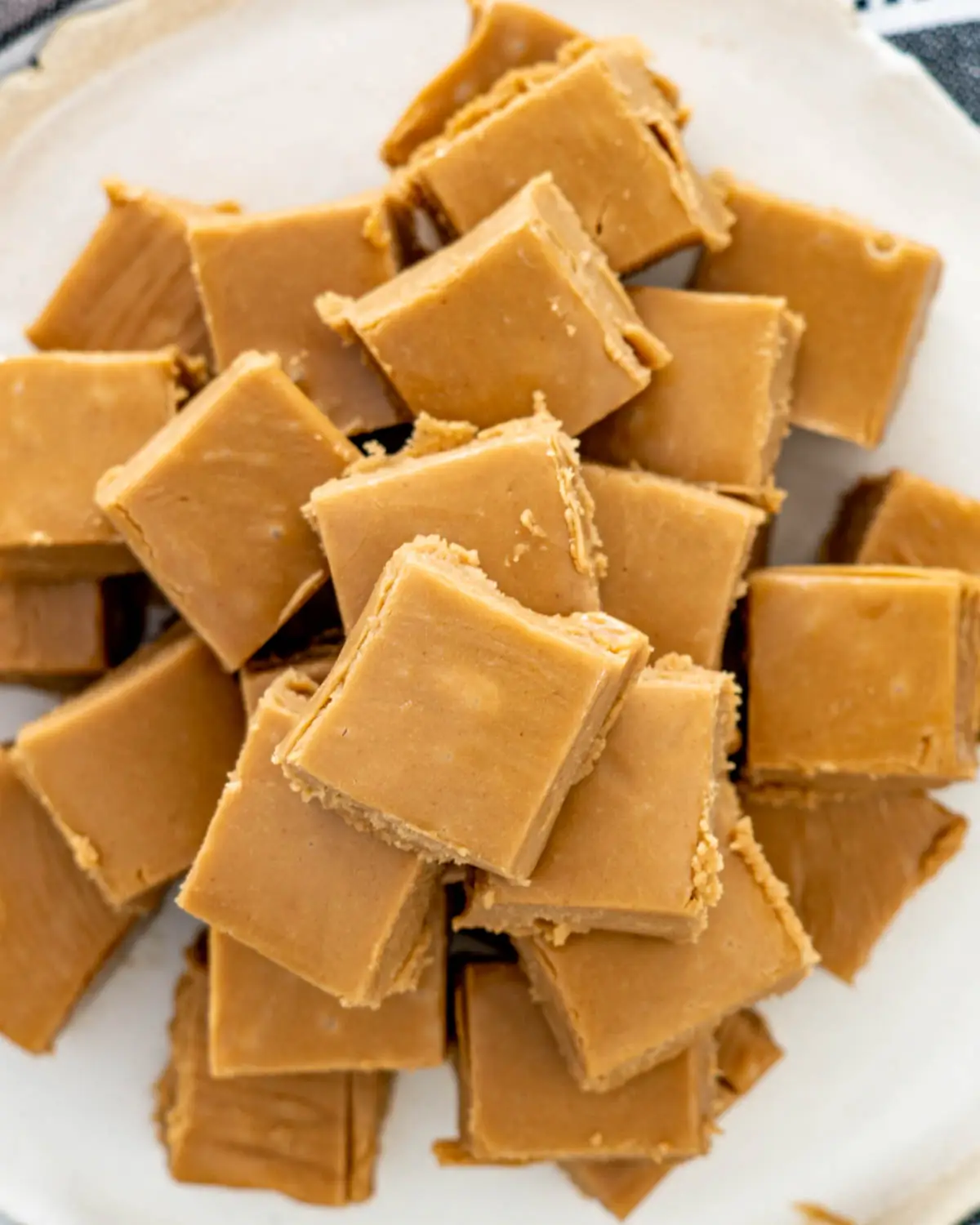 overhead shot of peanut butter fudge pieces on a plate.