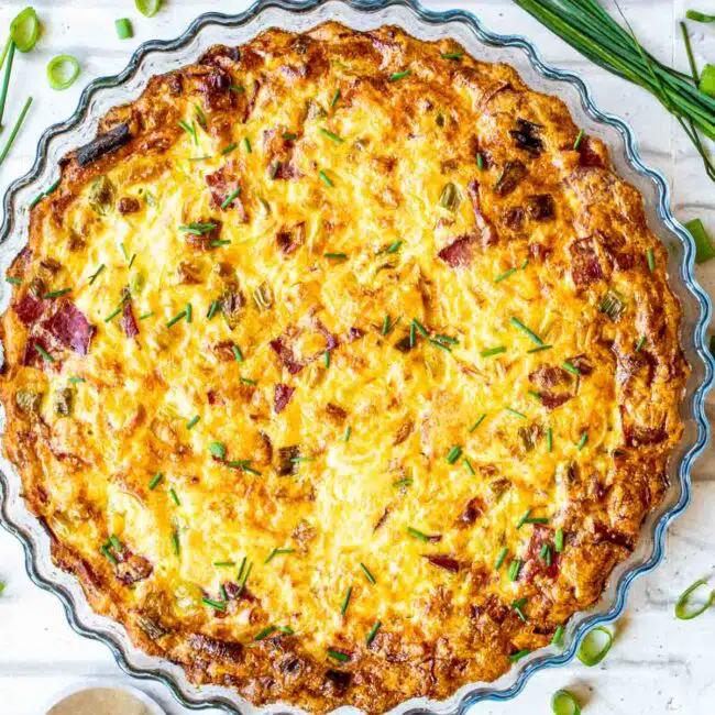 freshly baked crustless quiche in a quiche pan.