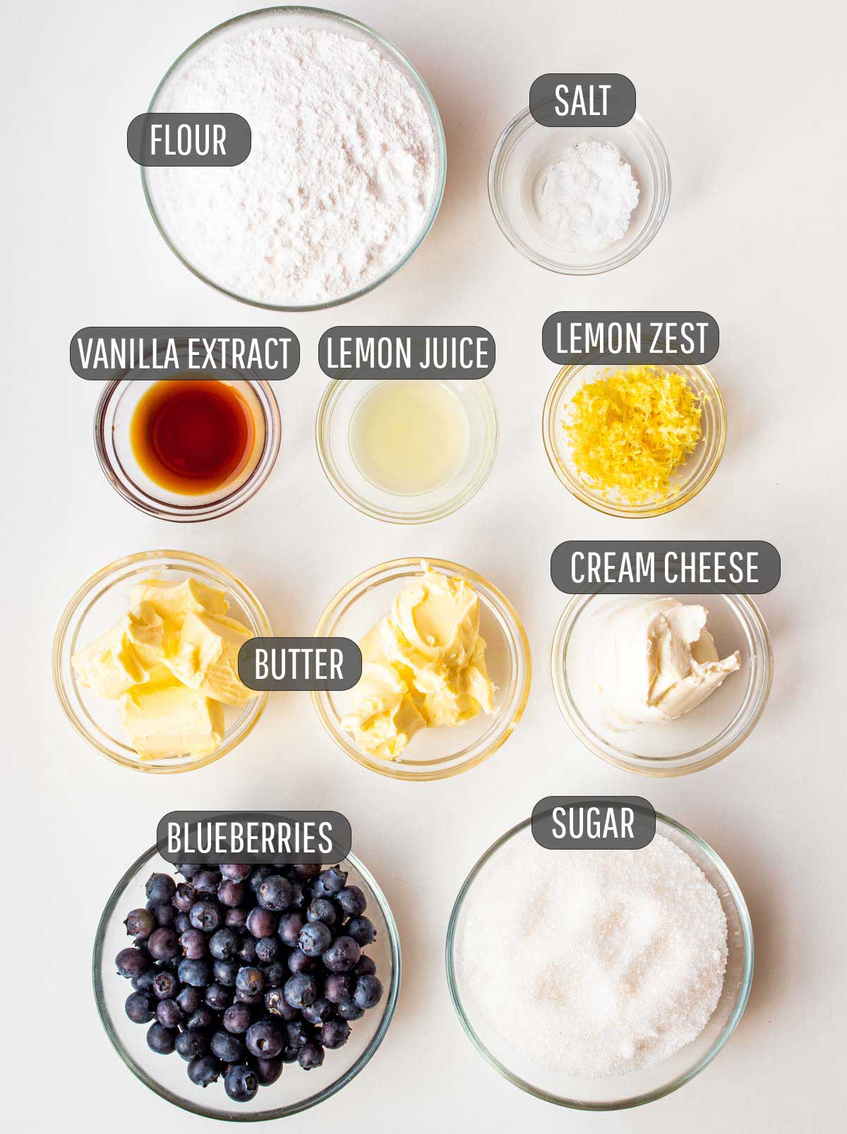 overhead shot of ingredients needed to make filling and cream cheese icing for blueberry rolls.