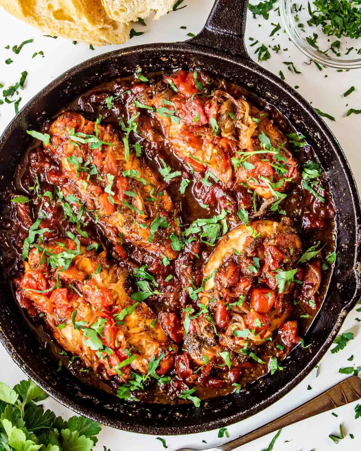 freshly made braised balsamic chicken in a skillet.