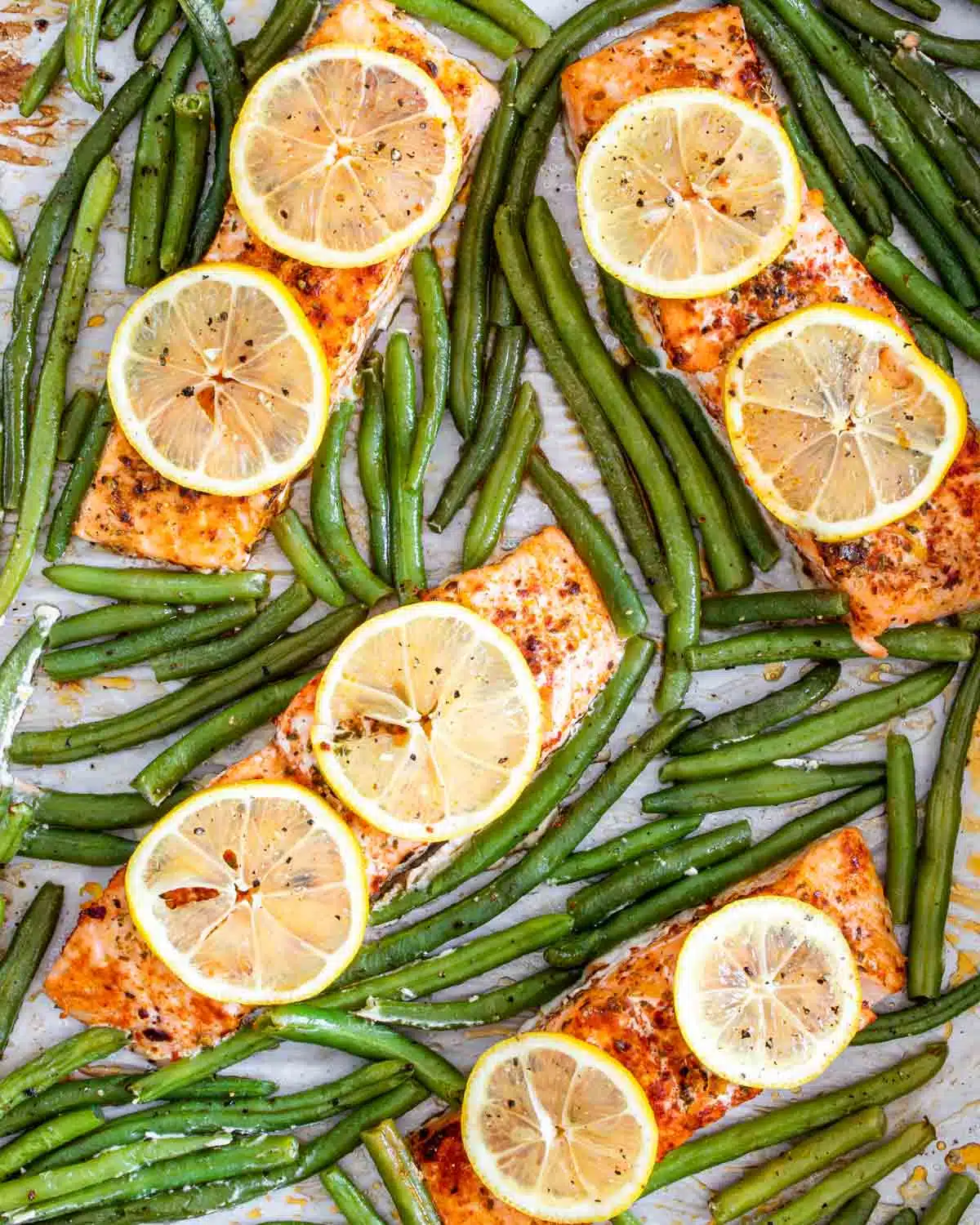 salmon and green beans on a sheet pan.