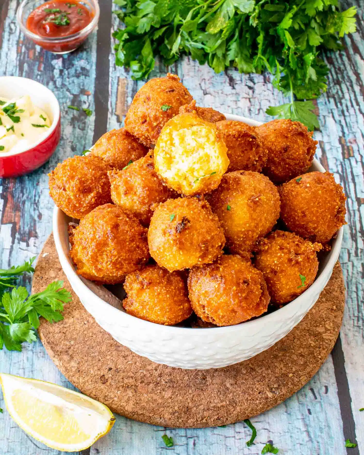 freshly made hush puppies in a bowl.