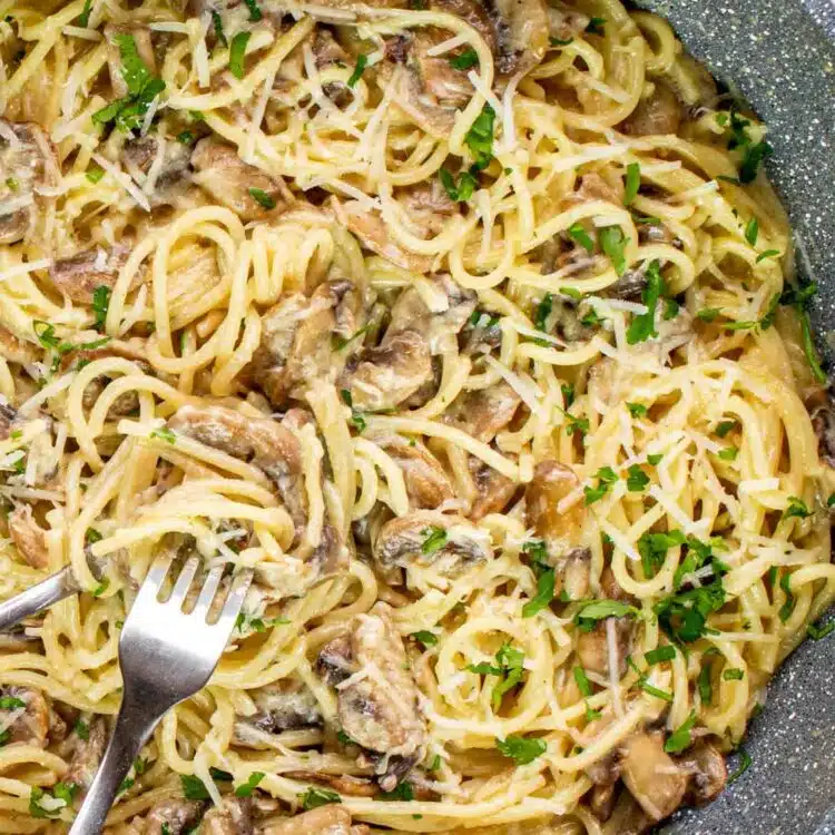 freshly made mushroom pasta in a skillet.