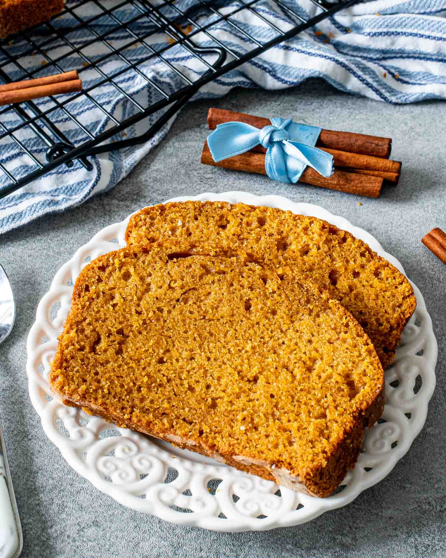 two slices of pumpkin bread on a white plate.