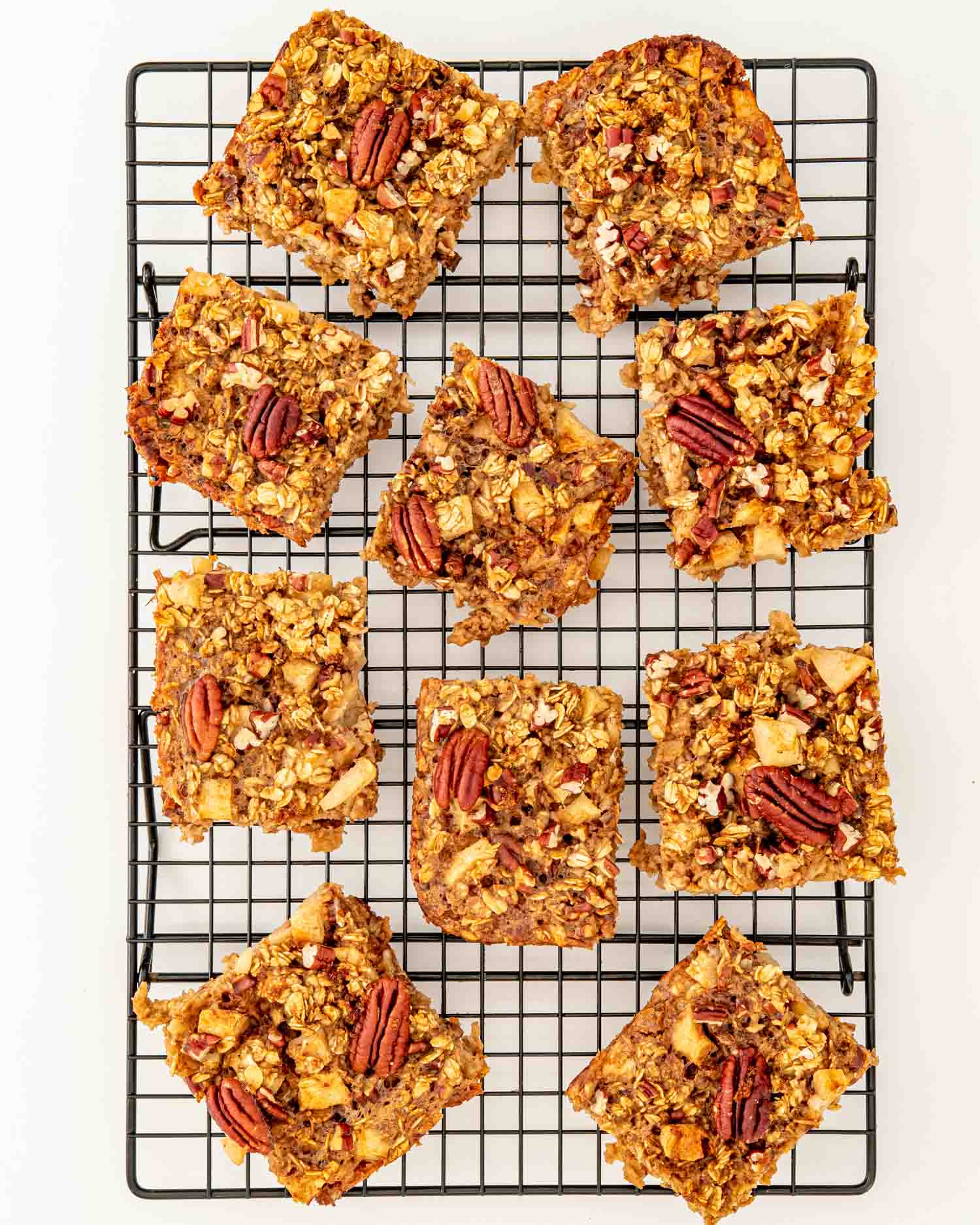 slices of apple baked oatmeal on a cooling rack.