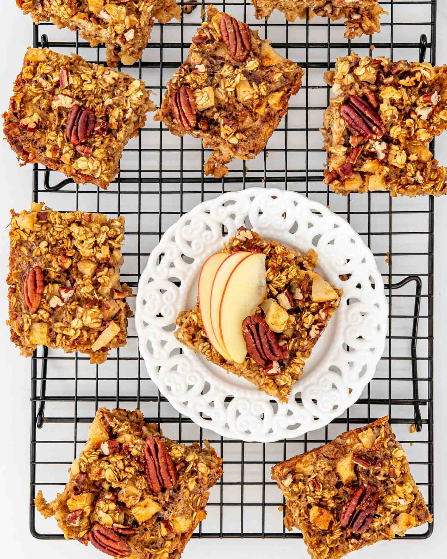 slices of apple baked oatmeal on a cooling rack.