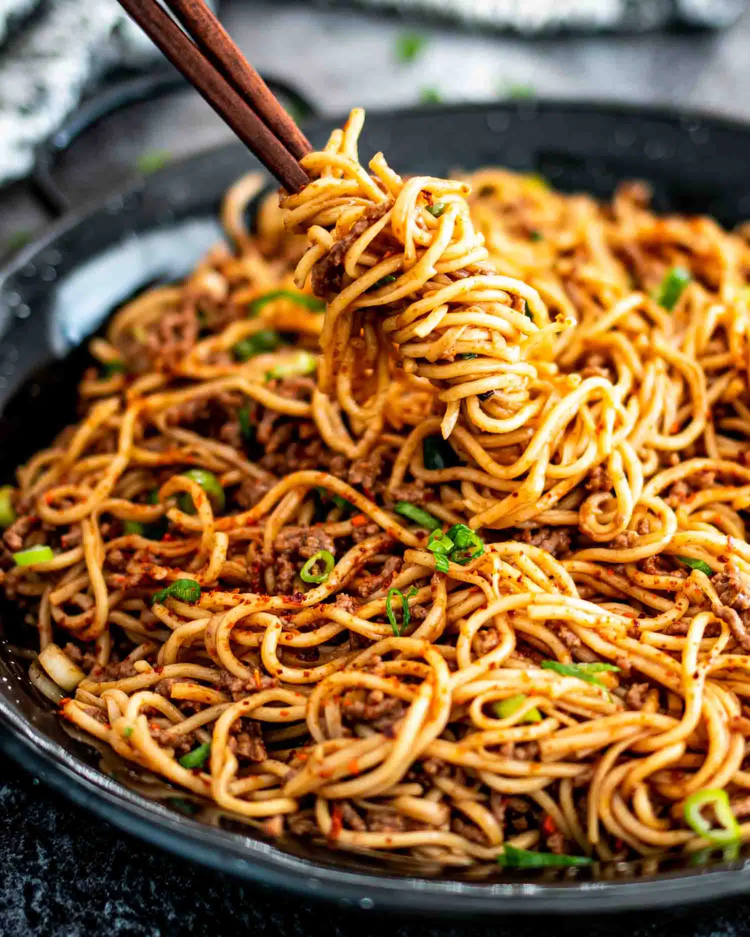 freshly made asian ground beef noodles in a skillet.