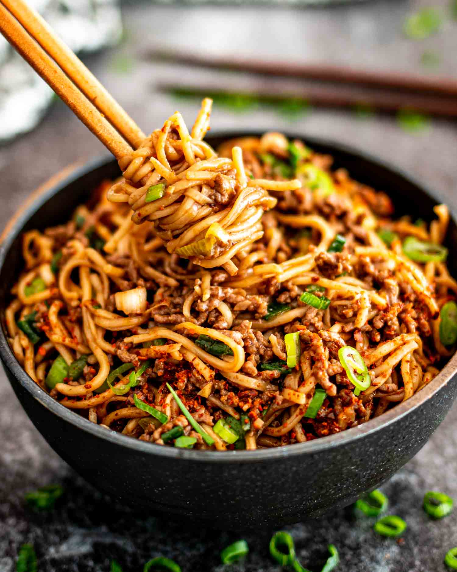 asian ground beef noodles in a bowl.