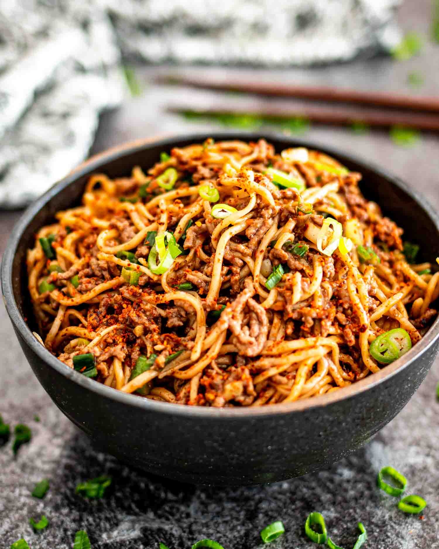 asian ground beef noodles in a bowl.