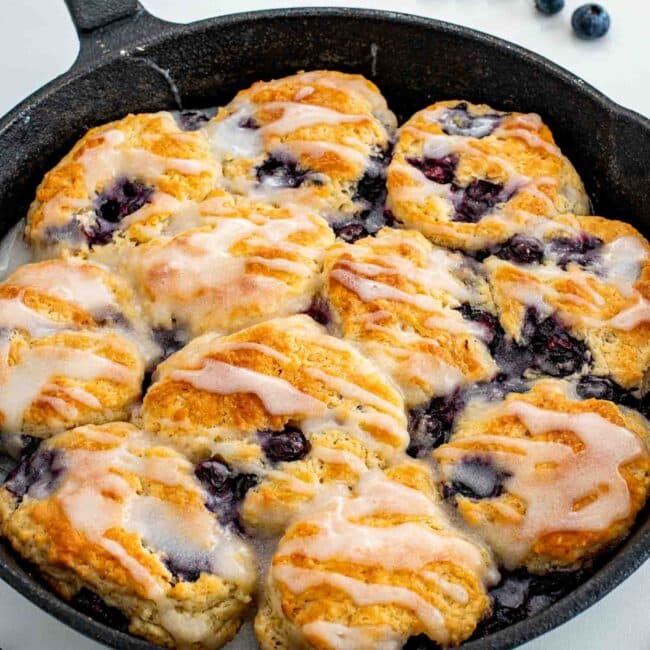freshly baked blueberry biscuits in a black cast iron skillet.