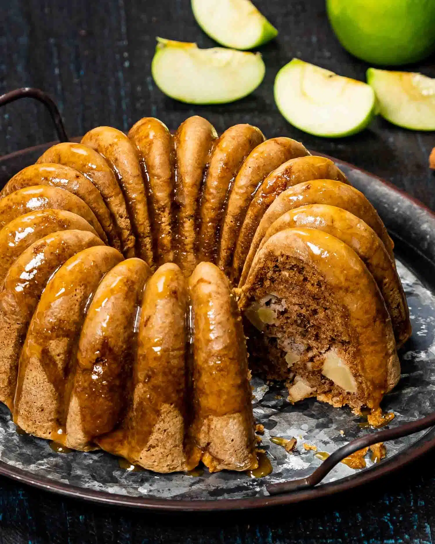 a caramel apple cake on a platter.