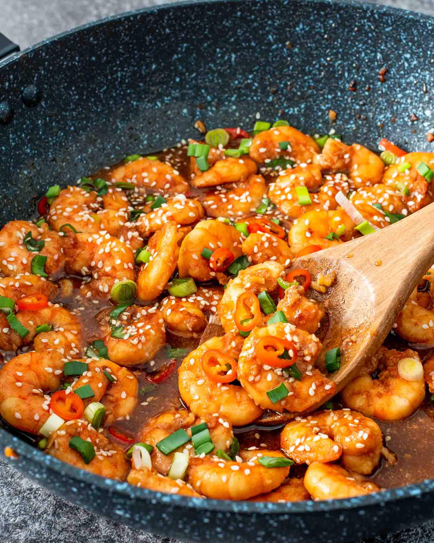 asian garlic shrimp in a wok.