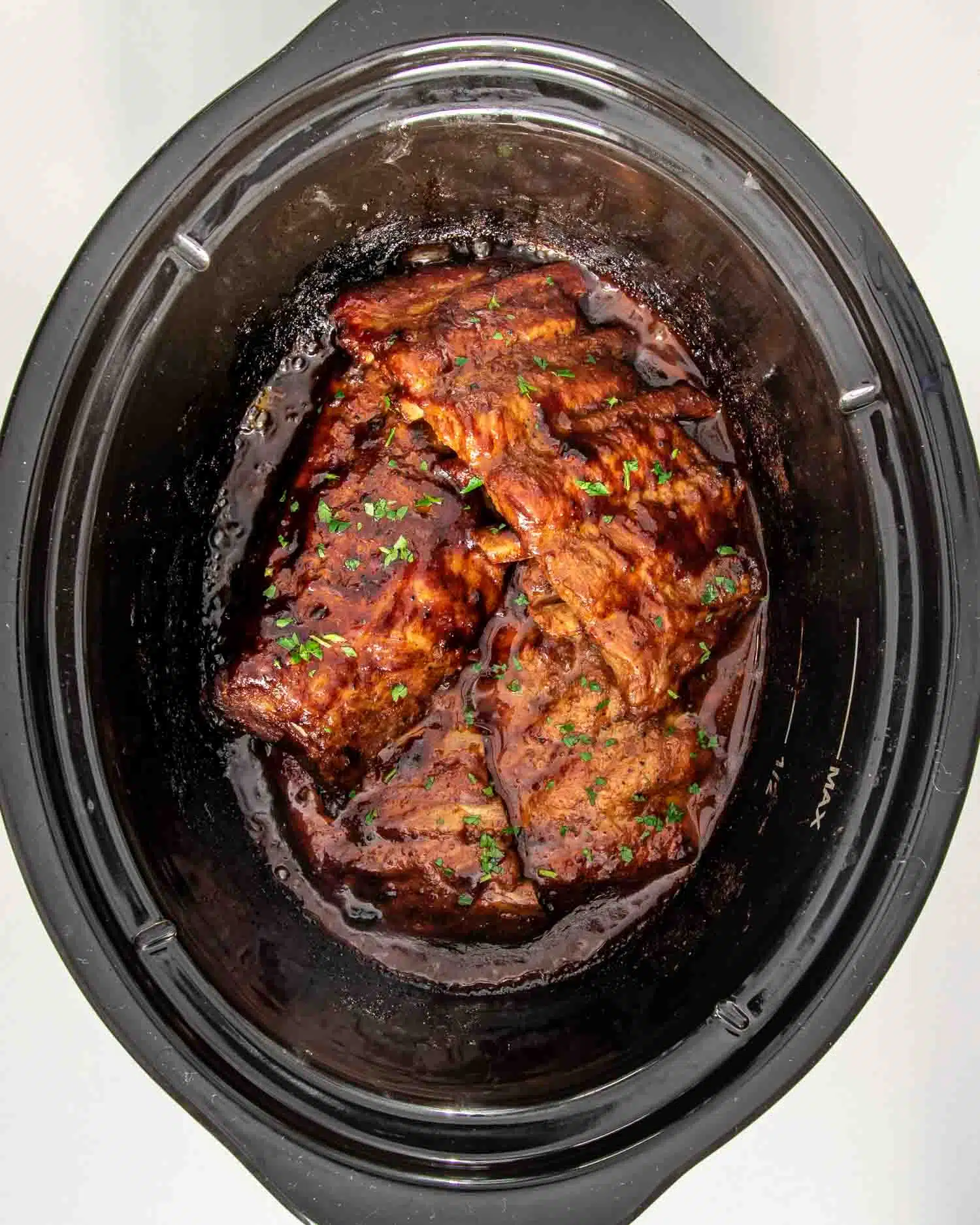 process shots showing how to make slow cooker ribs.