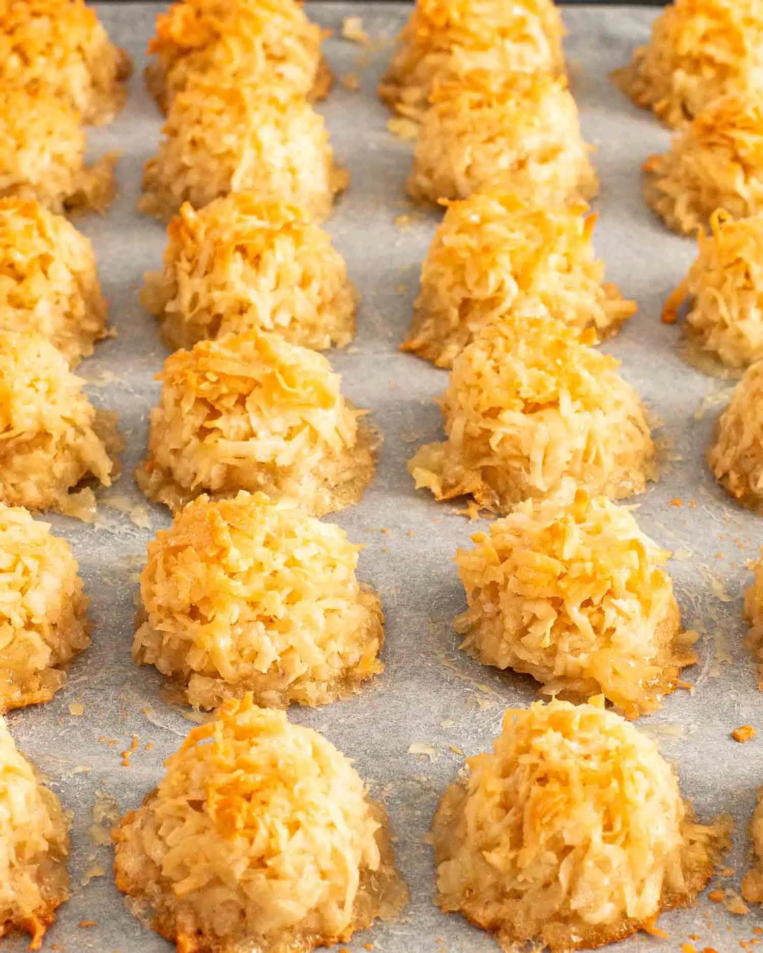 a baking sheet with coconut macaroons fresh out of the oven.