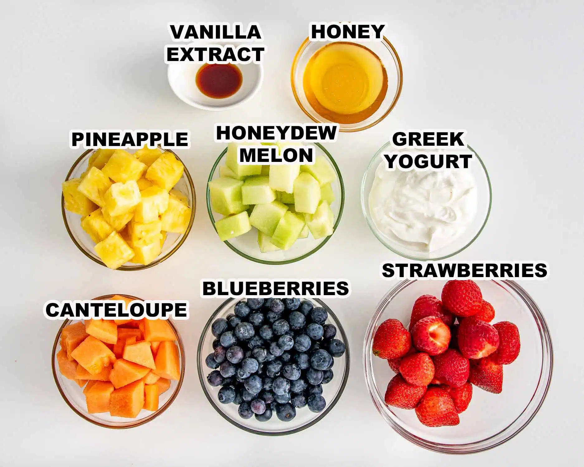 ingredients needed to make rainbow fruit skewers with yogurt dip.