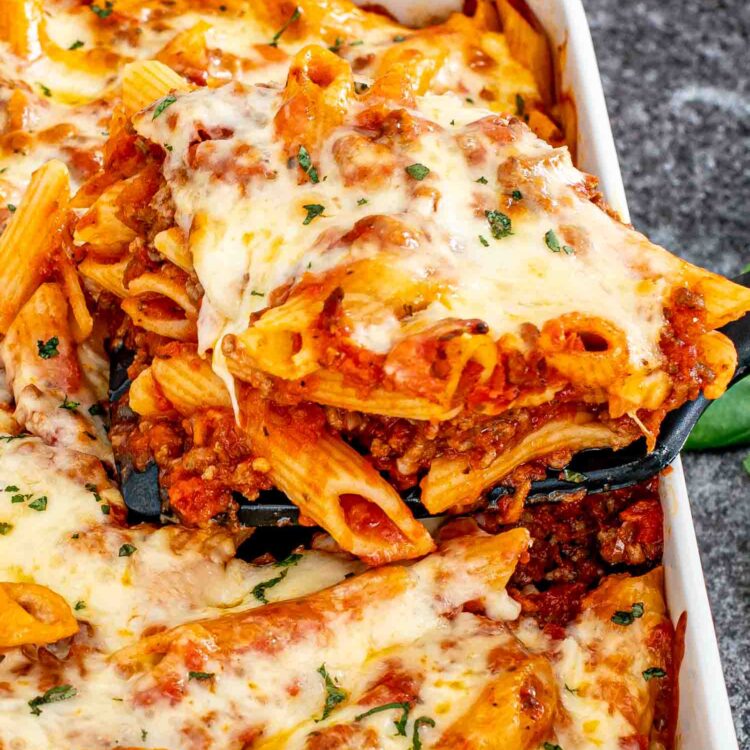 freshly baked mostaccioli in a white casserole dish.
