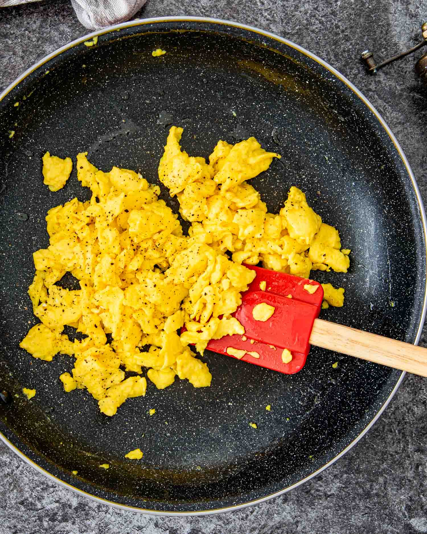 scrambled eggs freshly made in a skillet.