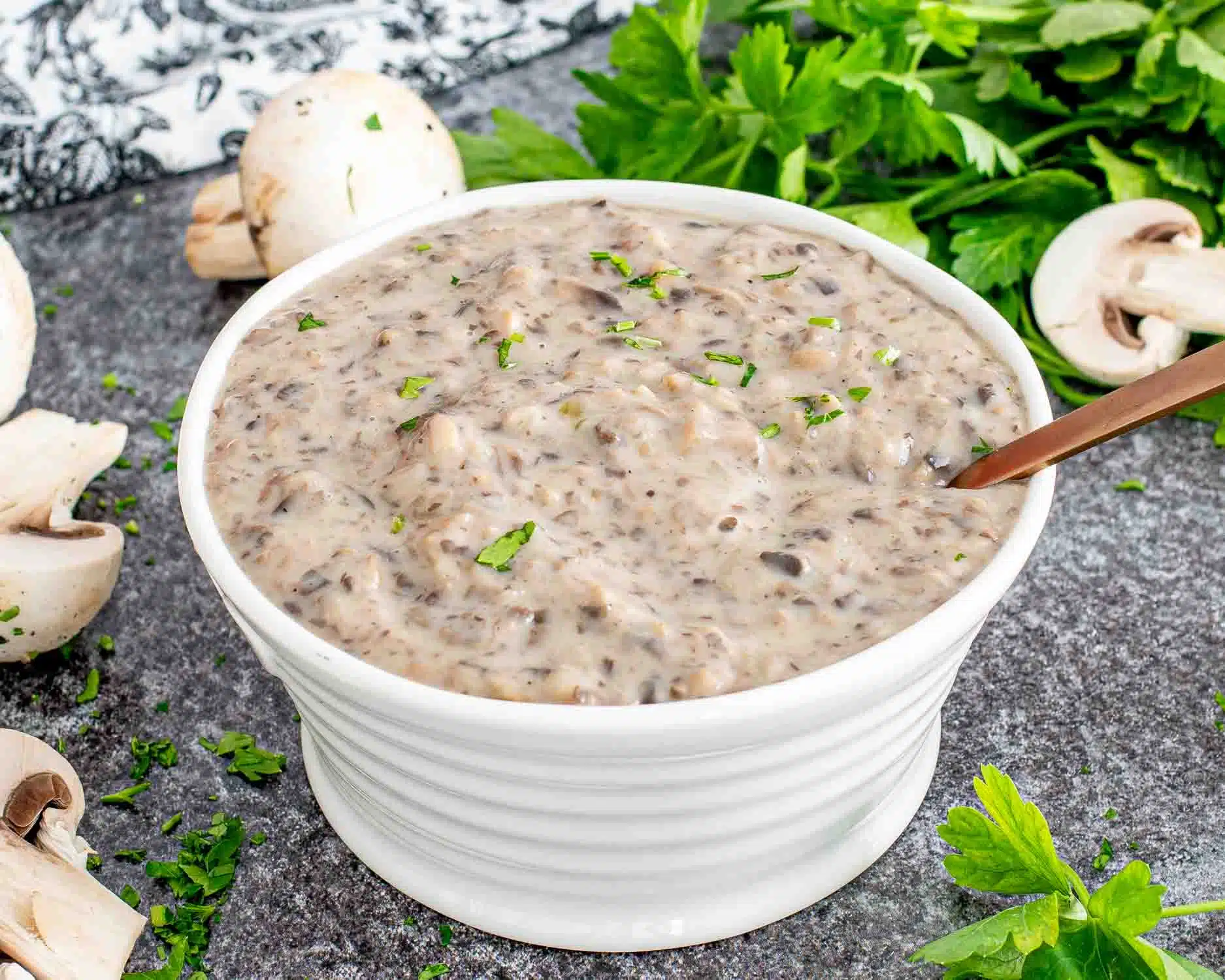condensed cream of mushroom soup in a white serving bowl.