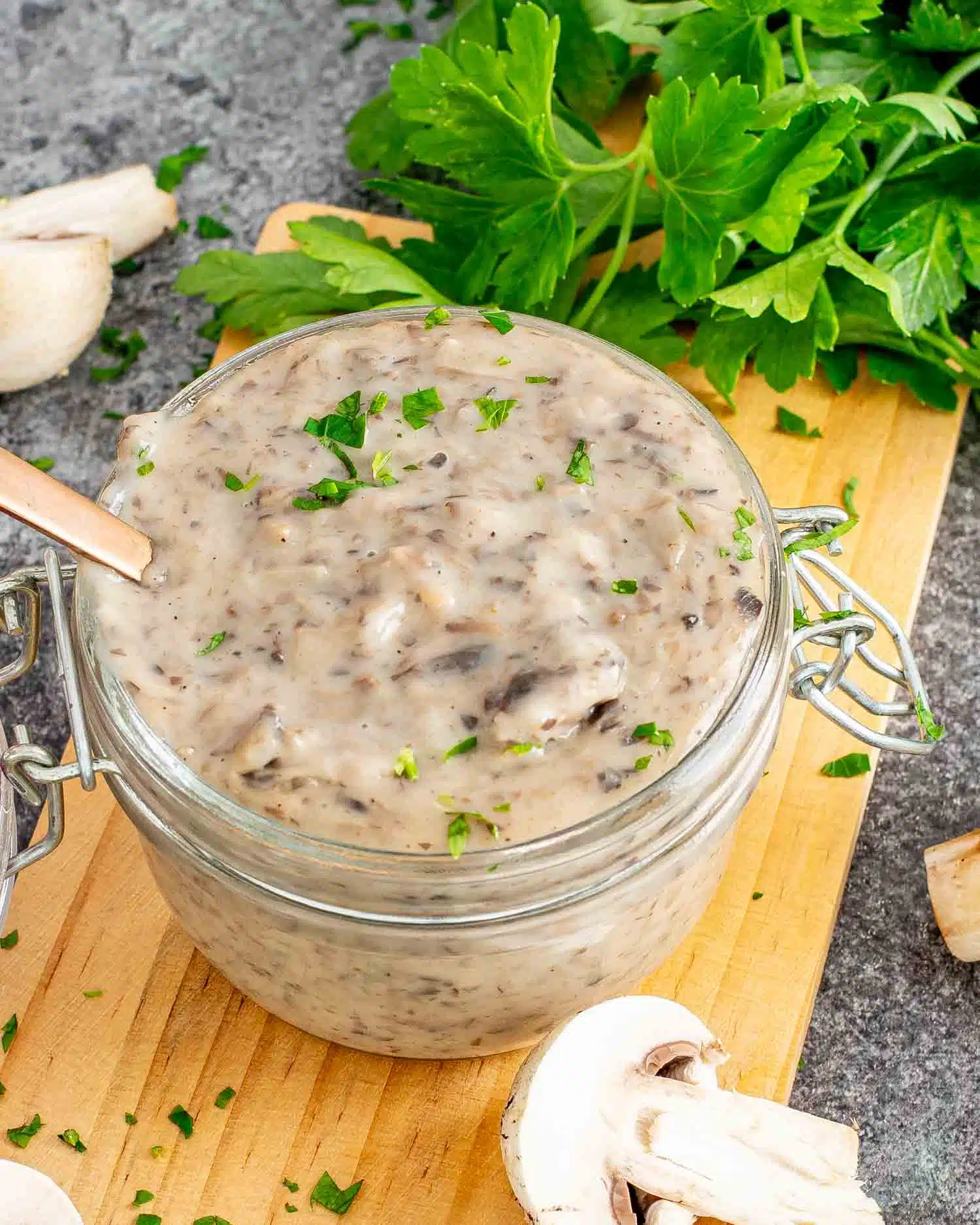 condensed cream of mushroom soup in a jar with a spoon inside.