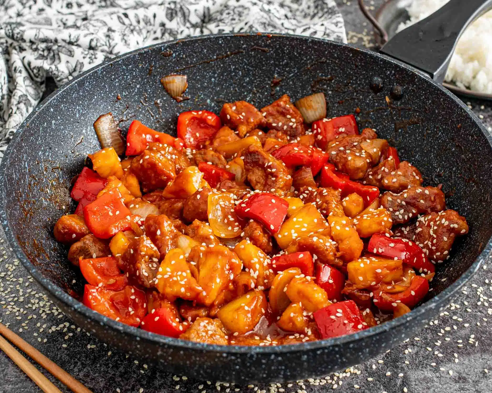 freshly made sweet and sour pork in a wok.