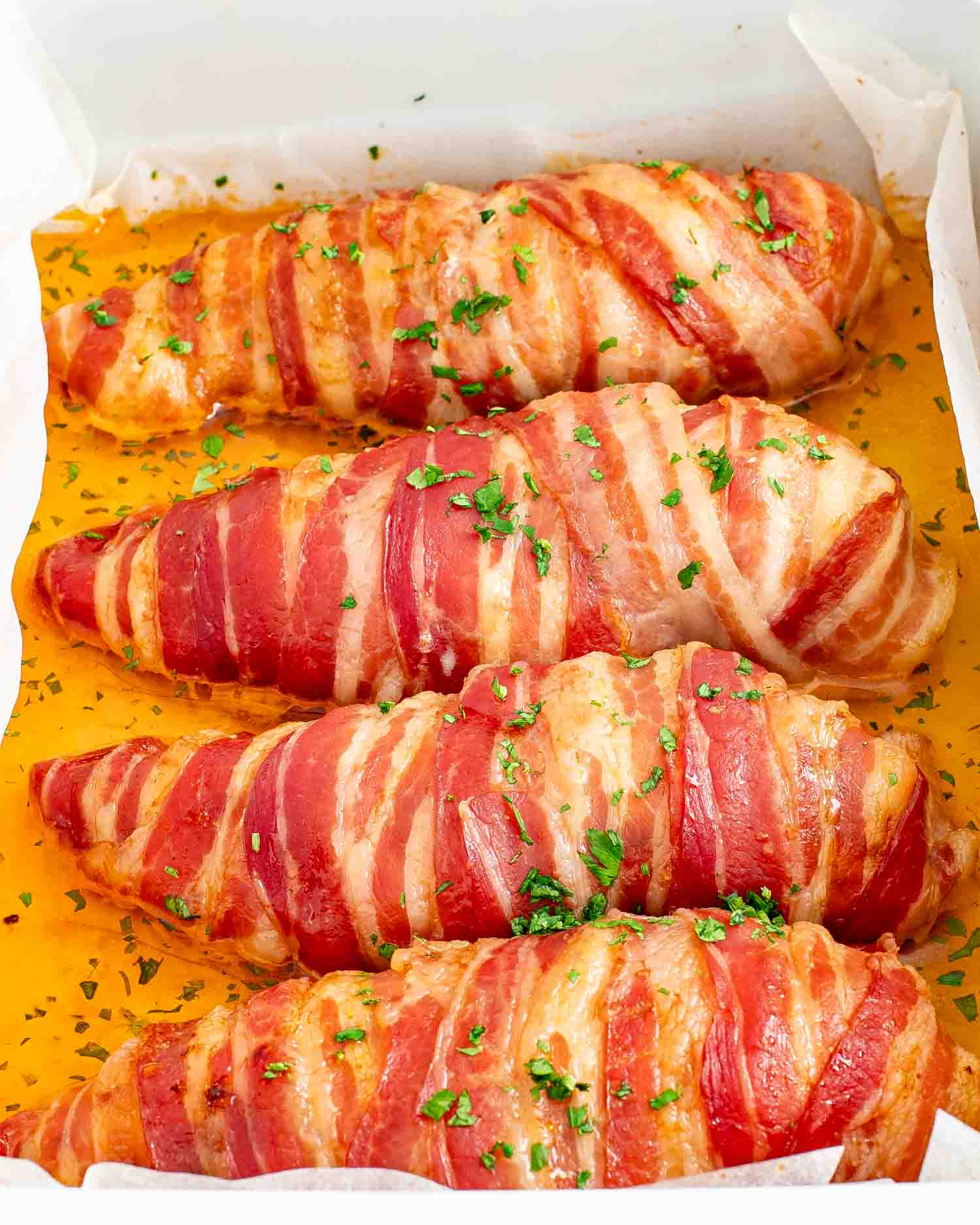 fresh out of the oven bacon wrapped chicken breast.
