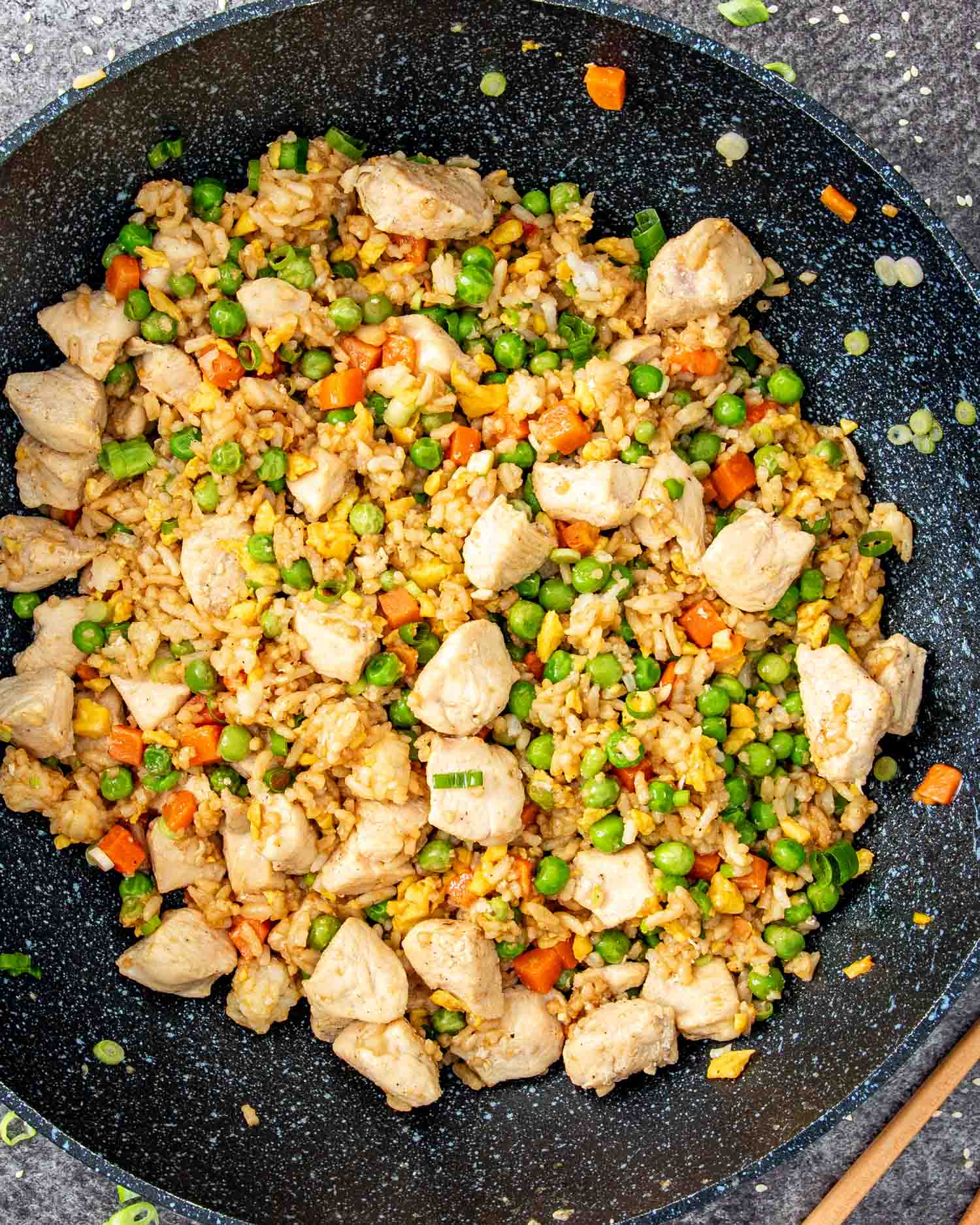 freshly made chicken fried rice in a wok.