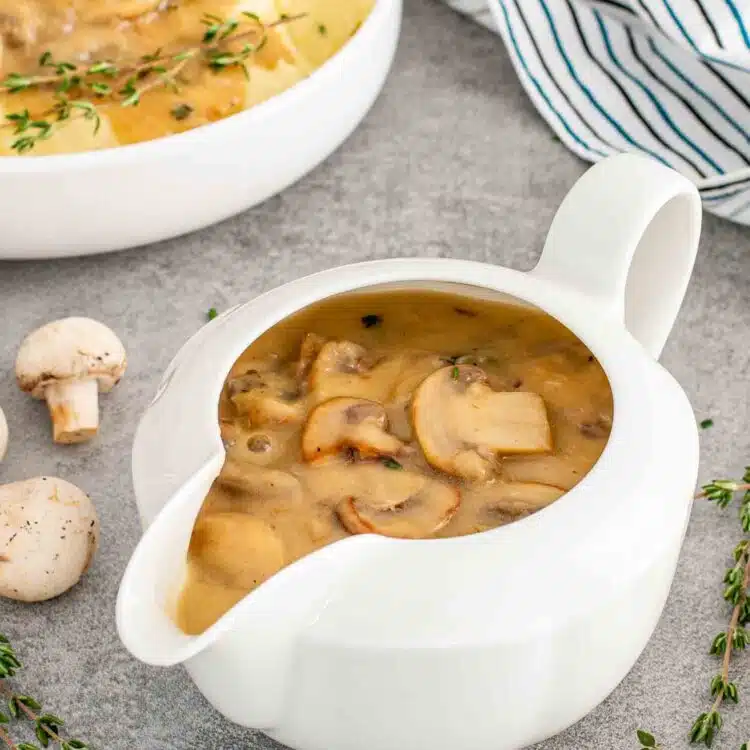 mushroom gravy in a white gravy bowl.